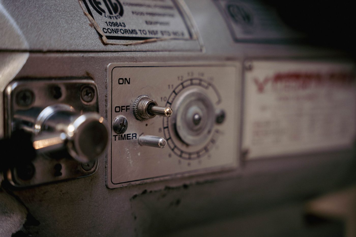 A close-up of a bread machine control panel with a gluten-free setting highlighted.